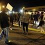 Crowds gathered on a street in Ferguson, Mo., Monday night.