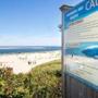 A sign warned beachgoers of the presence of great white sharks at Lighthouse Beach in Chatham.
