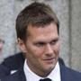 New England Patriots quarterback Tom Brady exits the Manhattan Federal Courthouse in New York August 12, 2015. A federal judge on Wednesday fired tough questions at a National Football League lawyer about whether Brady's four-game 
