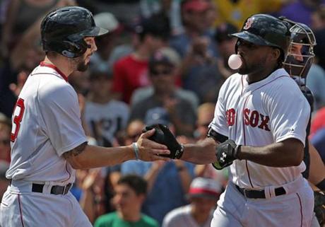 Jackie Bradley Jr. (right) hit two home runs against the Mariners on Saturday.

