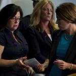 Attorney General Maura Healey (right) handed Cathy Fennelly, whose son, Paul, fatally overdosed from fentanyl-laced heroin, his death certificate. 