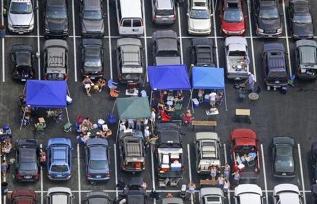 Patriots fans would likely pay a premium for the parking spots that were previously reserved for employees.
