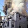 As smoke poured from the upper floors of 87 Linden St. in Allston in 2013, two people waited for rescue on a porch roof. 
