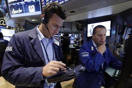 Trader Glenn Kessler (left) and specialist Robert Nelson worked on the floor of the New York Stock Exchange on Friday.
