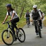 President Barack Obama trailed his daughter, Malia, as the family took a bike ride on Martha's Vineyard on Saturday. 