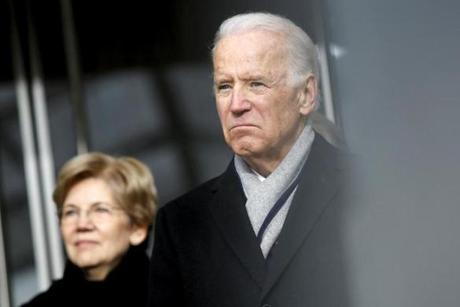 Senator Elizabeth Warren and VIce President Joe Biden listened to remarks at the dedication ceremony for the Edward M. Kennedy Institute for the United States Senate in Boston on March 30.
