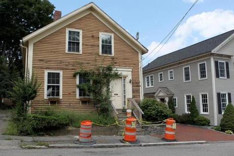 Caution tape and barrels were in front of a residence at 8 Strong St. in Newburyport.
