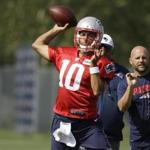 Patriots quarterback Jimmy Garoppolo winds up for a pass during Wednesday?s practice.