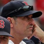 Boston Red Sox interim manager Torey Lovullo in the dugout during the first inning of a baseball game against the Seattle Mariners at Fenway Park in Boston Saturday, Aug. 16, 2015.(AP Photo/Winslow Townson)