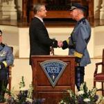 Governor Charlie Baker congratulates Richard D. McKeon, the new superintendent of the Massachusetts State Police, after he was sworn in during a ceremony at Mechanics Hall in Worcester.