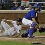 Boston Red Sox's Blake Swihart (23) slides past New York Mets catcher Travis d'Arnaud to score on an inside-the-park home run during the 10th inning of a baseball game Friday, Aug. 28, 2015, in New York. (AP Photo/Frank Franklin II)