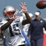 New England Patriots wider receiver Reggie Wayne makes a catch during an NFL football practice in Foxborough, Mass., Wednesday, Aug. 26, 2015. (AP Photo/Steven Senne)