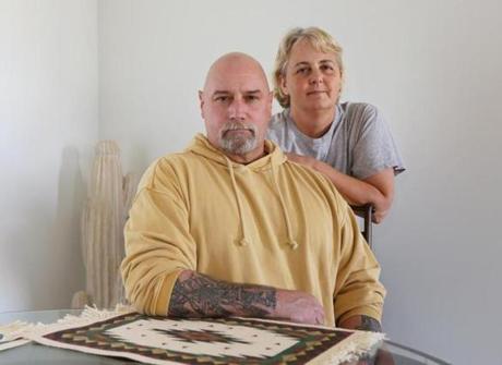 John Moore, 54, with his wife, Cathy, in their home in Apple Valley, Utah. Moore is battling stage IV metastatic melanoma; a precision treatment helped him, but only for a year.
