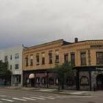 A developer is seeking a permit from Newton?s Historical Commission to raze a block of buildings in Newtonville.
