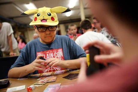 Elijah Gonzalez wore a Pikachu hat at a game in New Bedford.
Newcomer Joseph Rebello, 10, played a game of Pokémon Friday at New Bedford?s Global Learning Charter school.
