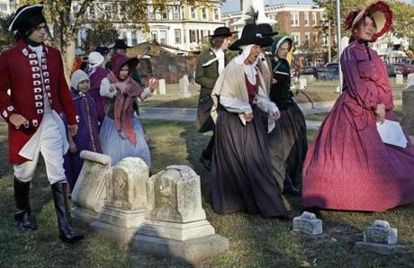 Performers dressed in costumes in Milk Row Cemetery sin 2007.
