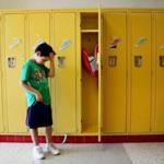 09/01/2015 Malden, MA Ð Second grader Andre Luiz Domingos (cq) 7, stands at his locker during the first day of class at Salemwood School in Malden, MA on September 09, 2015. Andre said he was a little nervous about going back to school but overall he felt, 