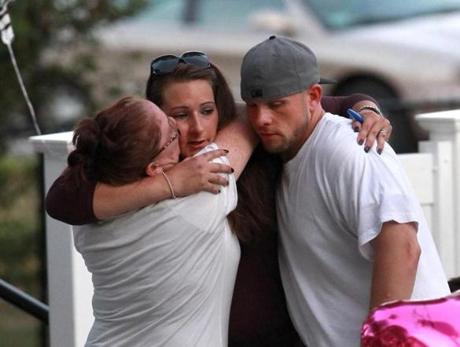 Jessica Conway, center, and Ronald Green were seen before a vigil for their daughter on Aug. 19. 
