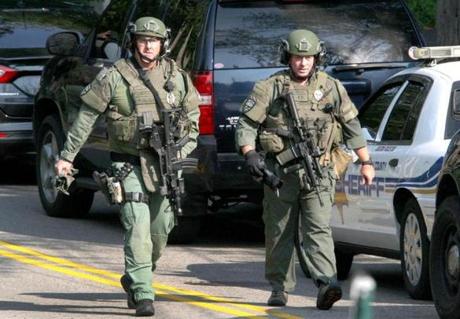 SWAT team police officers were seen Millis after a police cruiser was reportedly shot at. 
