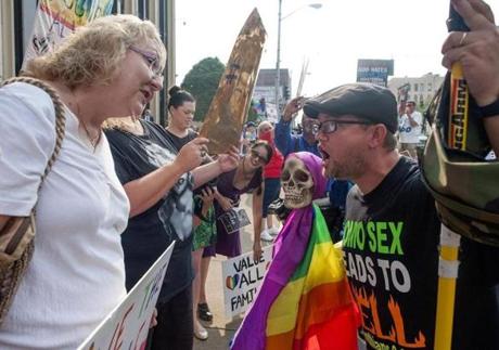 Two protestors got into a heated debate in front of the federal courthouse in Ashland, Kentucky, on Thursday.
