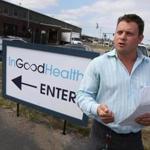 David Noble, president of In Good Health,  discussed opening day with media outside his facility.