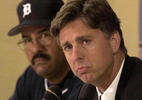 Dave Dombrowski said he has only once confronted a team in a closed-door clubhouse meeting ? the 2002 Detroit Tigers. He fired the manager early in the season and replaced him with bench coach Luis Pujols (rear).
