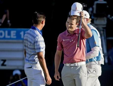 Taking off your cap is shake hands after a round, as Zach Johnson (right) and Rickie Fowler did, is golf etiquette that many have picked up from watching the professionals on television. 
