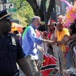 Mayor Bill de Blasio (center) shook hands with spectators at the West Indian Day Parade in Brooklyn.