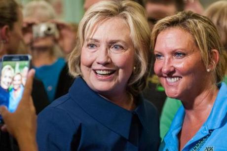 Democratic presidential candidate Hillary Clinton posed Monday with a supporter during a campaign stop in Cedar Rapids, Iowa.
