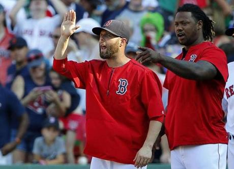 Injured Boston Red Sox players Dustin Pedroia, left, and Hanley Ramirez after the Boston Red Sox 11-4 win over the Toronto Blue Jays in a baseball game at Fenway Park in Boston Monday, Sept. 7, 2015. (AP Photo/Winslow Townson)
