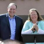 Rowan County Clerk Kim Davis, with Republican presidential candidate Mike Huckabee (left) greeted the crowd after being released from Carter County Detention Center.