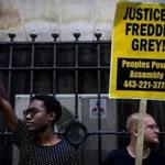 Those protesting Freddie Gray?s death stood outside a Baltimore courthouse on Sept. 2. The city said it will pay $6.4 million to Gray?s family to settle a lawsuit.