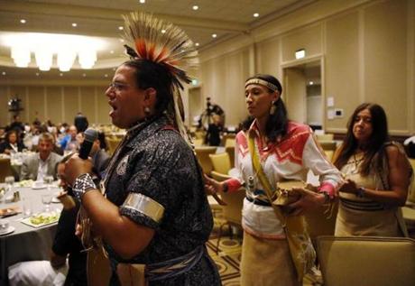 Aquinnah Wampanoag Councilman Jonathan Perry, Mashpee Wampanoag senior planner Danielle Hill, and Mashpee Wampanoag Kitty Hendricks performed in traditional garb at the Native American Financial Officers conference at the Westin Copley in Boston.
