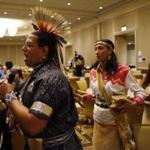 Aquinnah Wampanoag Councilman Jonathan Perry, Mashpee Wampanoag senior planner Danielle Hill, and Mashpee Wampanoag Kitty Hendricks performed in traditional garb at the Native American Financial Officers conference at the Westin Copley in Boston.