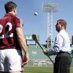 Mayor Martin J. Walsh took a crack at hurling Tuesday at Fenway Park with Galway team member David Collins.