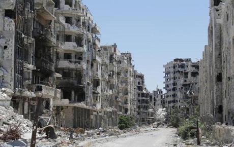 Destroyed buildings were seen in an area of Homs that was recaptured by Syrian government forces in 2013. 
