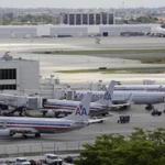 American Airlines jets were seen at their gates at Miami International Airport in August. 