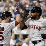 Boston Red Sox's Jackie Bradley, right, celebrates his two run home run with teammate Dustin Pedroia, left, during the ninth inning of a baseball game, Saturday, Sept. 19, 2015 in Toronto. Boston won 7-6. (Nathan Denette/The Canadian Press via AP) MANDATORY CREDIT