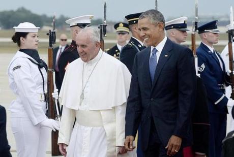 Pope Francis arrived at Joint Base Andrews in Maryland, where he was greeted by President Obama and his wife, Michelle, on Tuesday.
