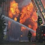 Fire fighters from surrounding communities battles a 6 alarm fire on Stevens Street in Haverhill, Sunday afternoon. The fire broke out in an abandoned mill building. Mark Lorenz for the Boston Globe