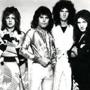 Left to right: Roger Taylor, Freddie Mercury, Brian May, and John Deacon  of Queen 