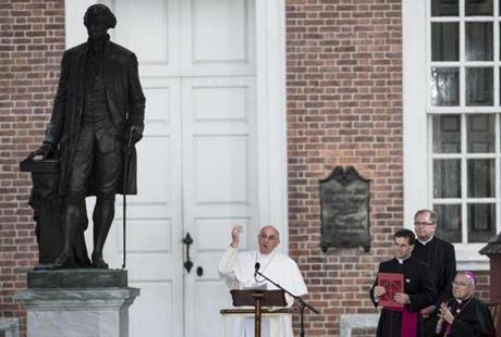 Pope Francis spoke from the steps of Independence Hall.
People in the crowd listened, shed tears,  and snapped photos as Pope Francis spoke at Independence Hall.
