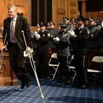 Governor Charlie Baker walked with crutches at the annual George L. Hanna Memorial Awards on Tuesday