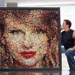 Andover artist Rob Surette with his portrait of Taylor Swift made of gumballs. The artwork won first place in the Ripley's Believe It or Not! contest. 