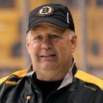 Boston- 10/01/15 - The Boston Bruins held a practice at TD Garden before their Media Day there. Coach Claude Julien listens to Bruins CEO Charlie Jacobs speak. Boston Globe staff photo by John Tlumacki(sports)