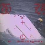 A Coast Guard helicopter crew investigated a lifeboat Sunday that was found from the missing ship El Faro.