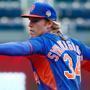 KANSAS CITY, MO - OCTOBER 26: Noah Syndergaard #34 of the New York Mets pitches during the Mets workout the day before Game 1 of the 2015 World Series between the Kansas City Royals and Mets at Kauffman Stadium on October 26, 2015 in Kansas City, Missouri. (Photo by Maxx Wolfson/Getty Images)