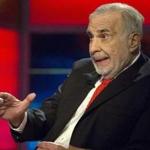 Billionaire activist-investor Carl Icahn gives an interview on FOX Business Network's Neil Cavuto show in New York, in this file photo taken February 11, 2014. In an interview with Reuters, Icahn ramped up criticism of the U.S. Federal Reserve, warning about the unintended consequences of ultra low interest rates on the economy and financial markets. REUTERS/Brendan McDermid/Files