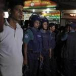 Bangladeshi security officers stood guard at the entrance to a hospital ward where publisher Ahmed Rahim Tutul and two writers were being treated. 