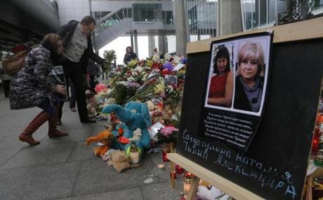 Portraits of two plane crash victims, Natalia Soldatulina and Alexandra Pilip, were placed near flowers and toys at an entrance of Pulkovo airport outside St. Petersburg. 
